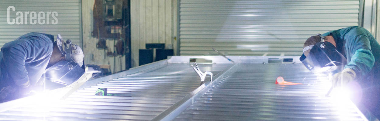 Welders completing a trailer.